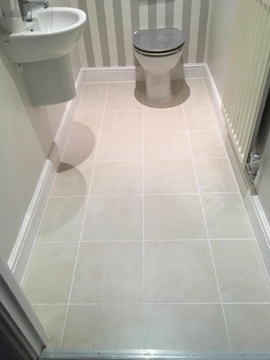 A newly tiled floor in a cloakroom. We removed the old and tired ...